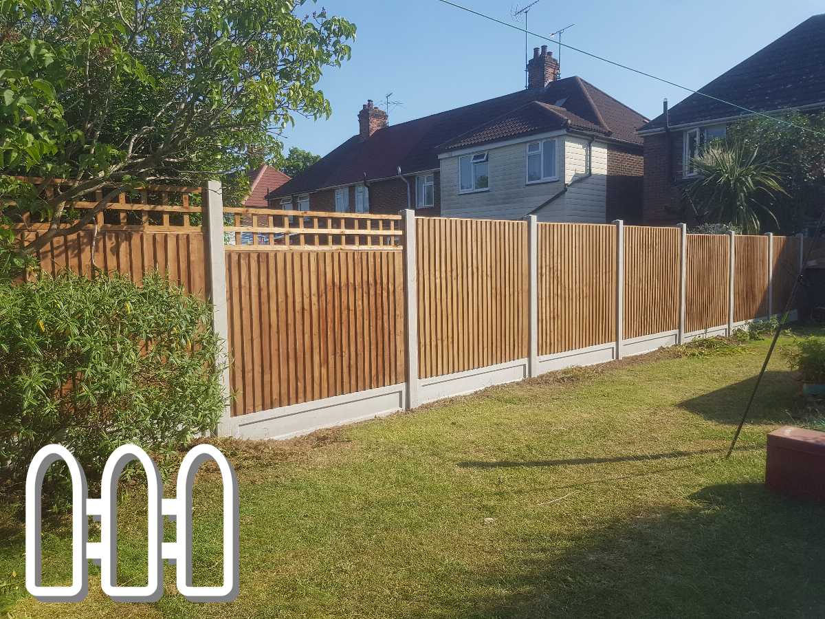 Newly installed wooden fencing in a residential backyard with lattice top design, providing privacy and aesthetic appeal.