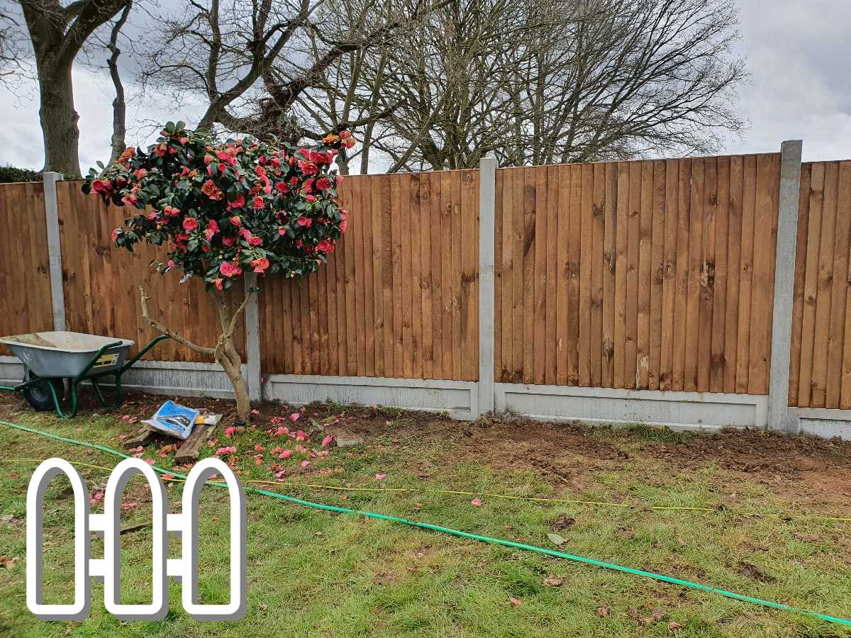 Durable wooden fence spanning the backyard of a suburban garden, enhancing privacy and security