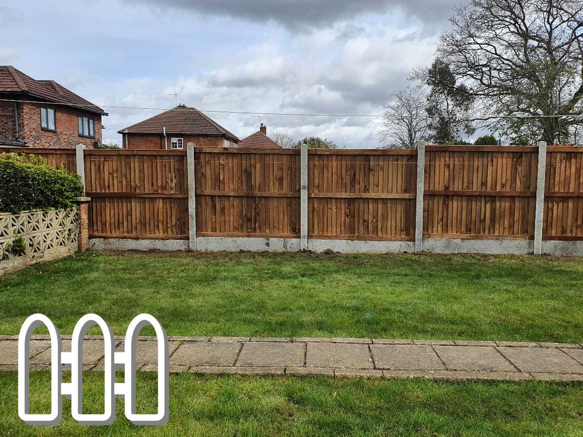 Well-maintained wooden fence with concrete posts dividing lush green lawns from a residential property